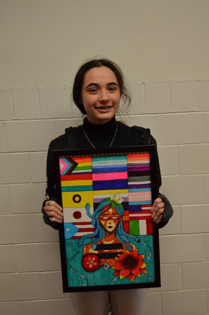Art club student with artwork